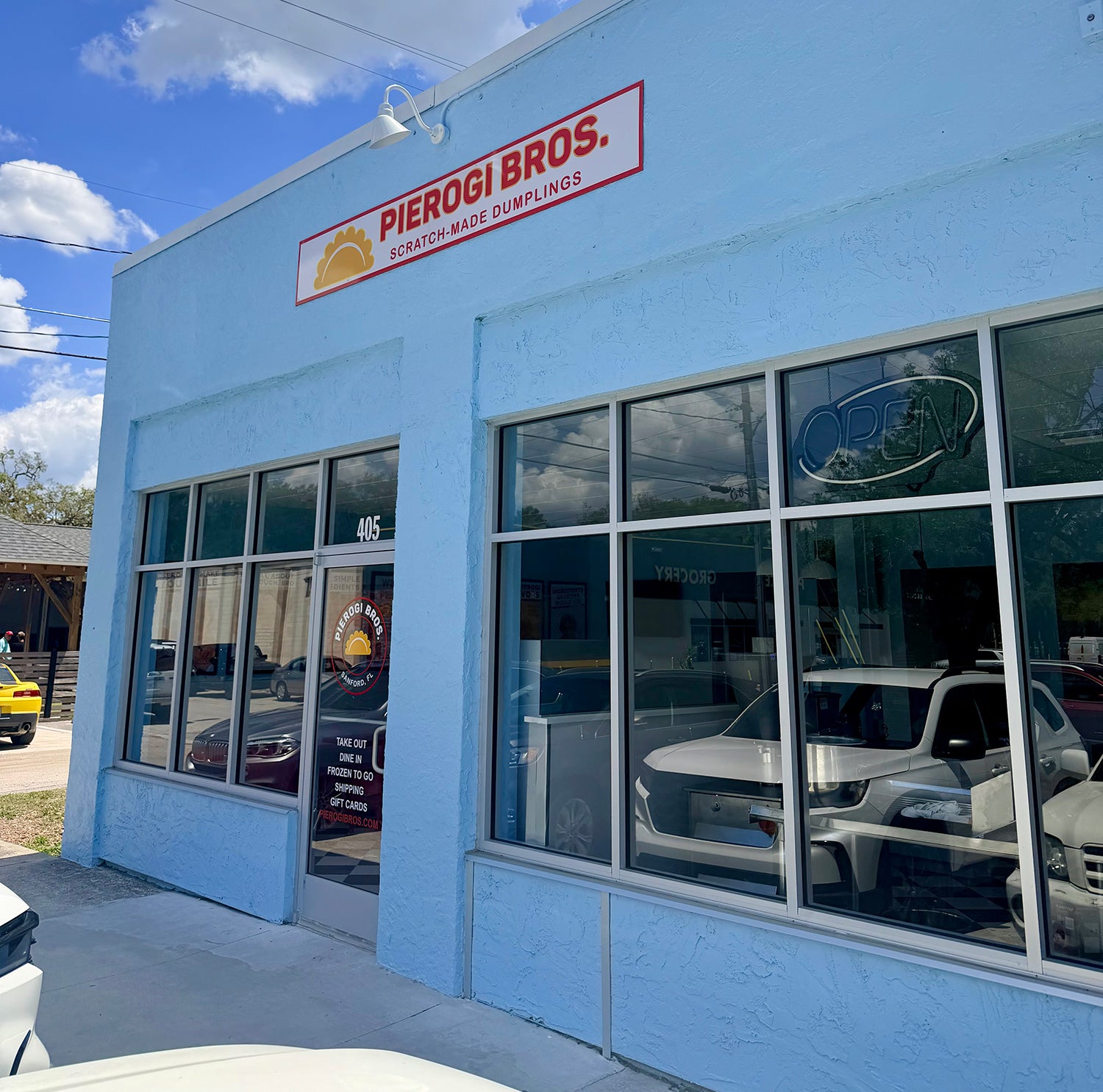 Image of the exterior of Pierogi Bros restaurant in Sanford Florida - blue building with Pierogi Bros sign